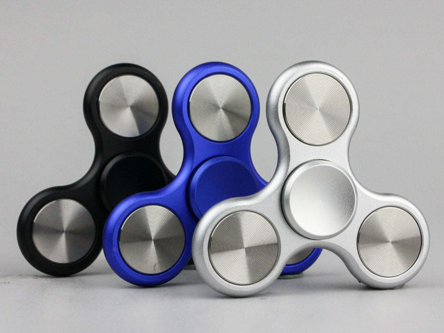 The Classic fidget spinner - tri shape metal spinner, in black, silver, blue, red, and orange