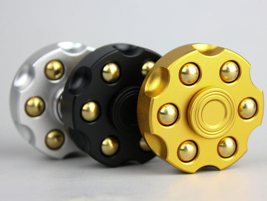 Revolver fidget spinner - brass metal with plated colored finish. Removable weights