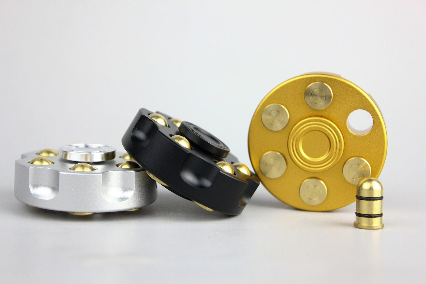 Revolver fidget spinner - brass metal with plated colored finish. Removable weights
