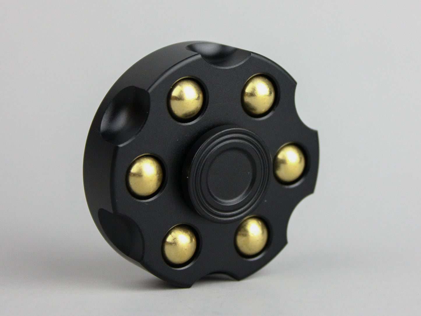 Revolver fidget spinner - brass metal with plated colored finish. Removable weights