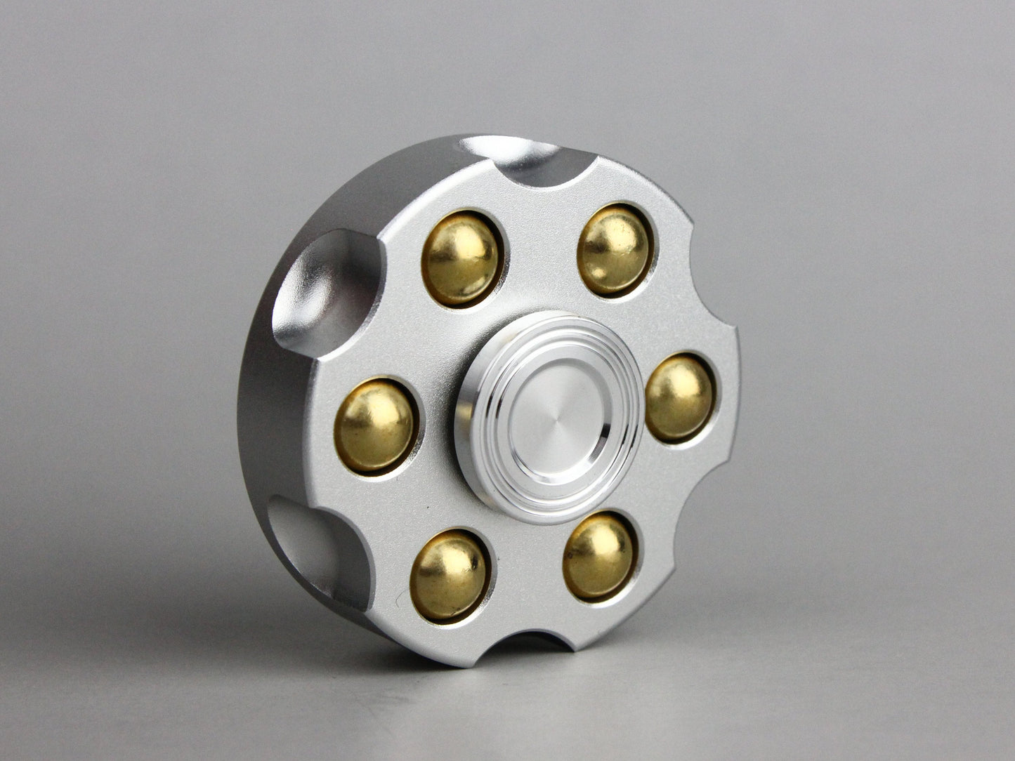 Revolver fidget spinner - brass metal with plated colored finish. Removable weights
