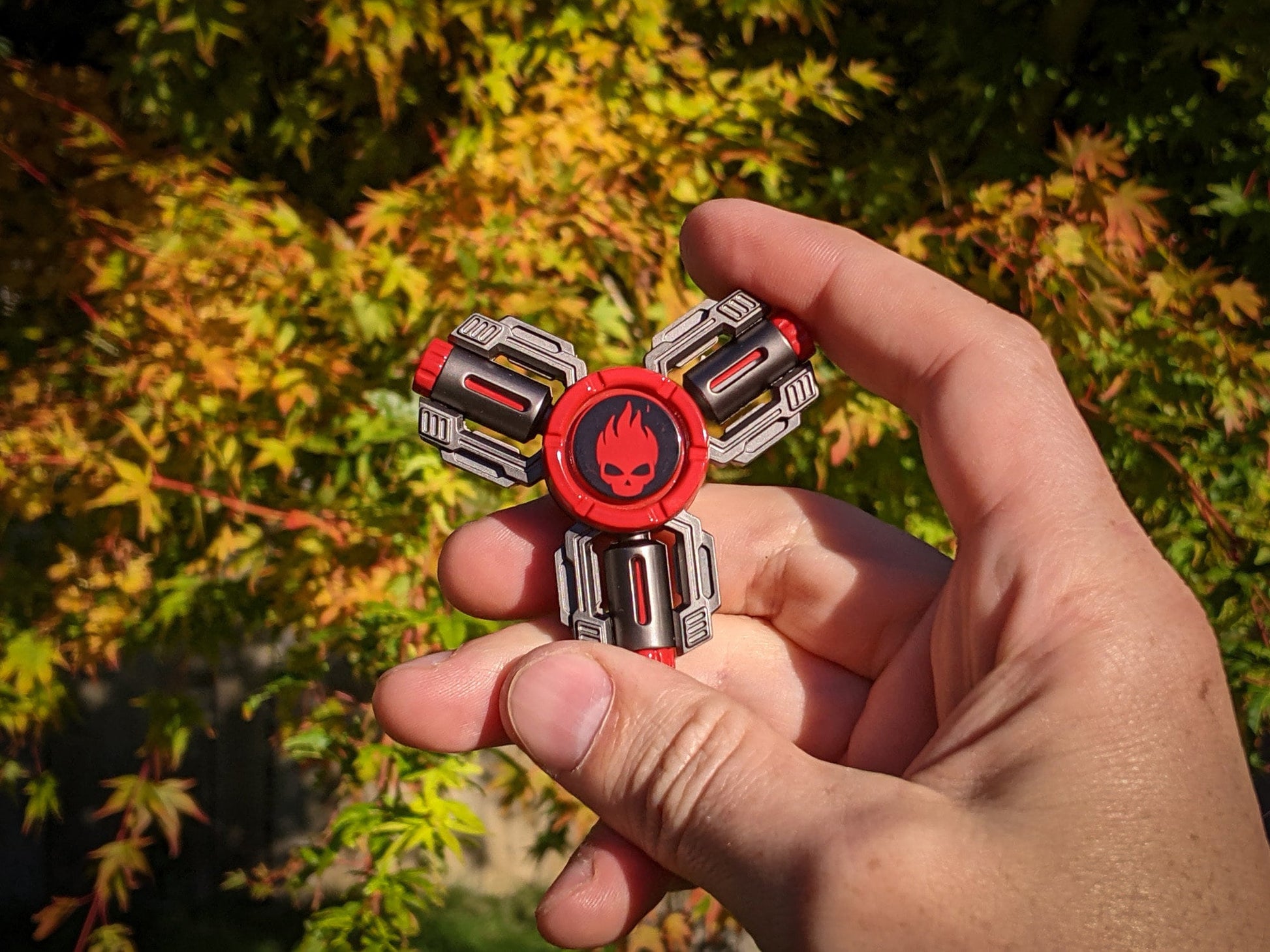 Flaming Skull 3 - tri-shaped fidget spinner in gunmetal and red