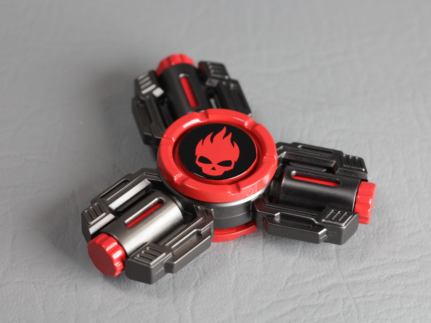 Flaming Skull 3 - tri-shaped fidget spinner in gunmetal and red