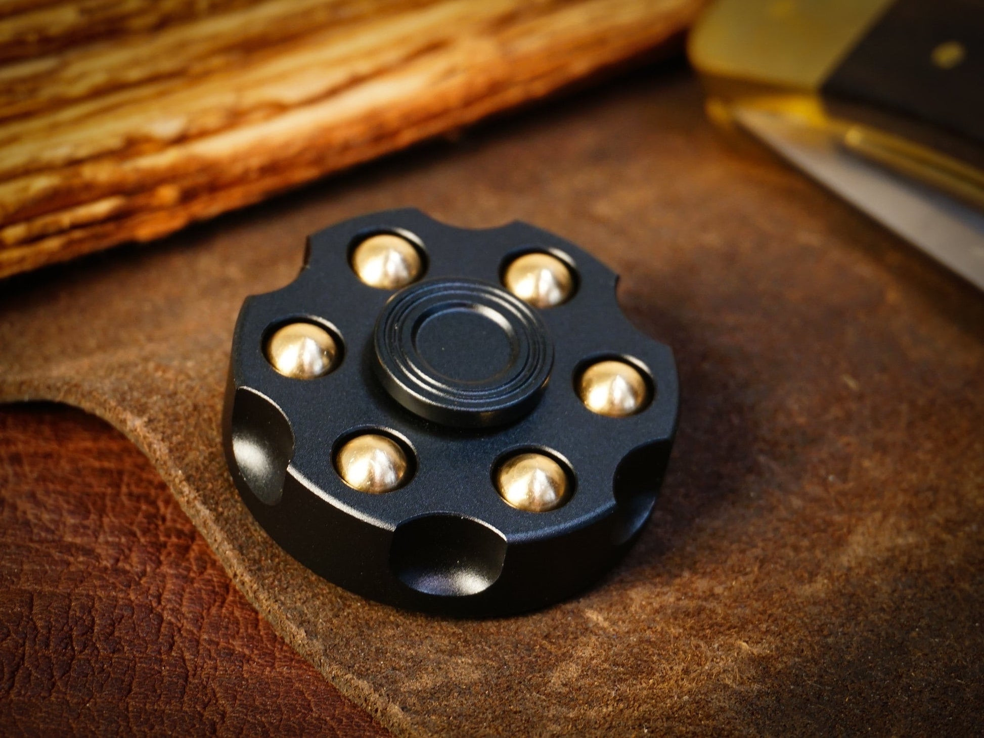 Revolver fidget spinner - brass metal with plated colored finish. Removable weights