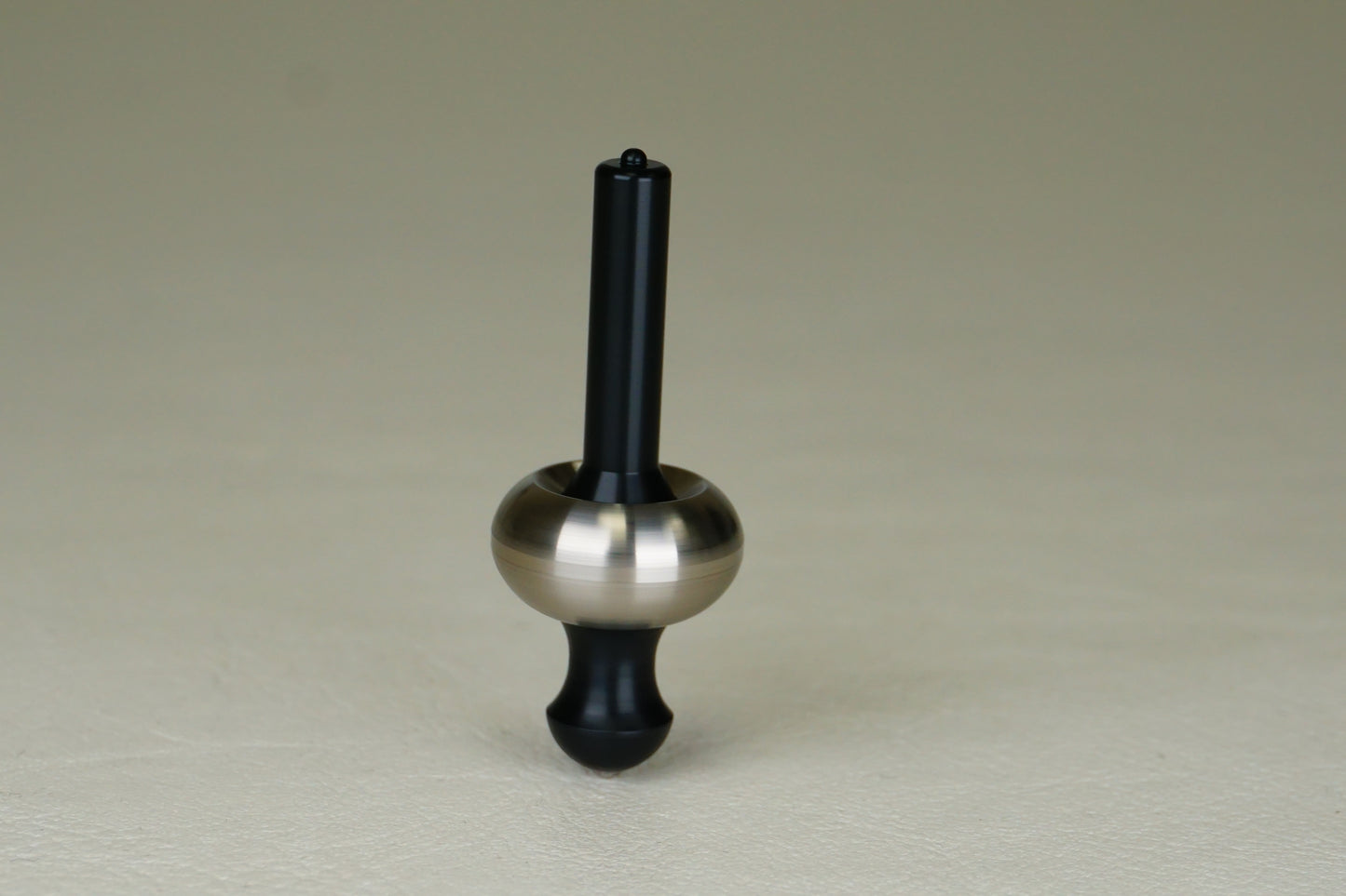 Flick top - the jumping titanium spinning top