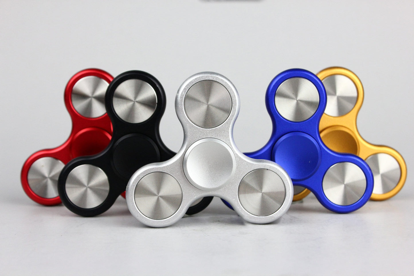 The Classic fidget spinner - tri shape metal spinner, in black, silver, blue, red, and orange