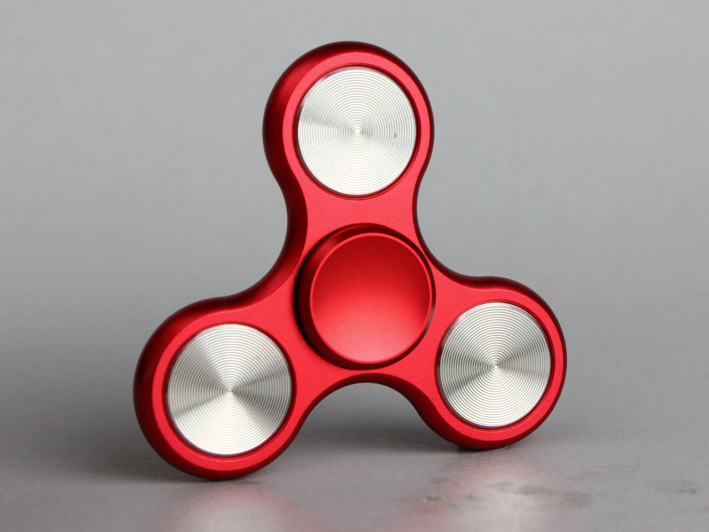 The Classic fidget spinner - tri shape metal spinner, in black, silver, blue, red, and orange