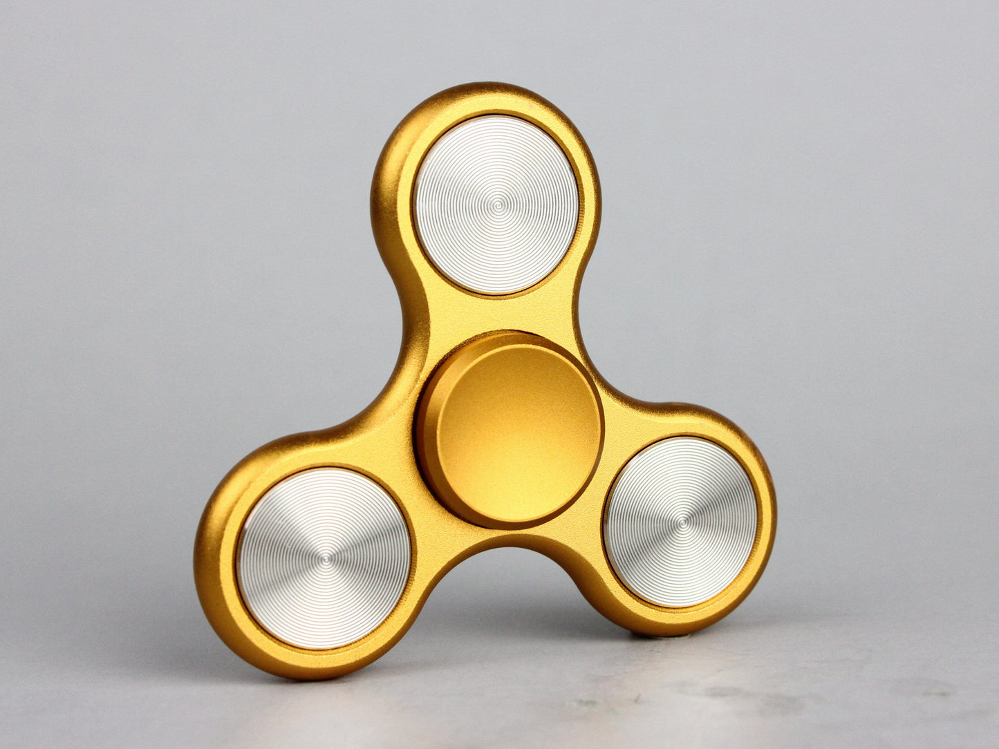 The Classic fidget spinner - tri shape metal spinner, in black, silver, blue, red, and orange