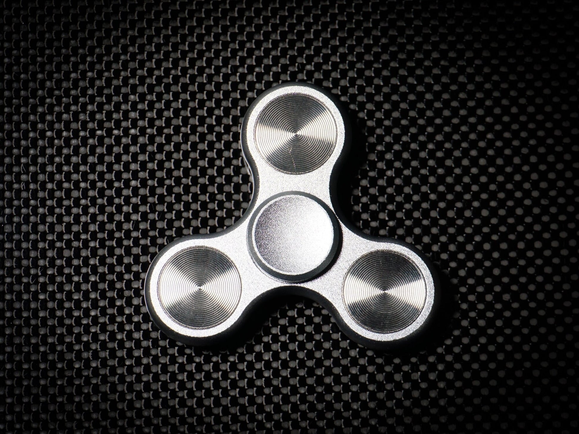 The Classic fidget spinner - tri shape metal spinner, in black, silver, blue, red, and orange