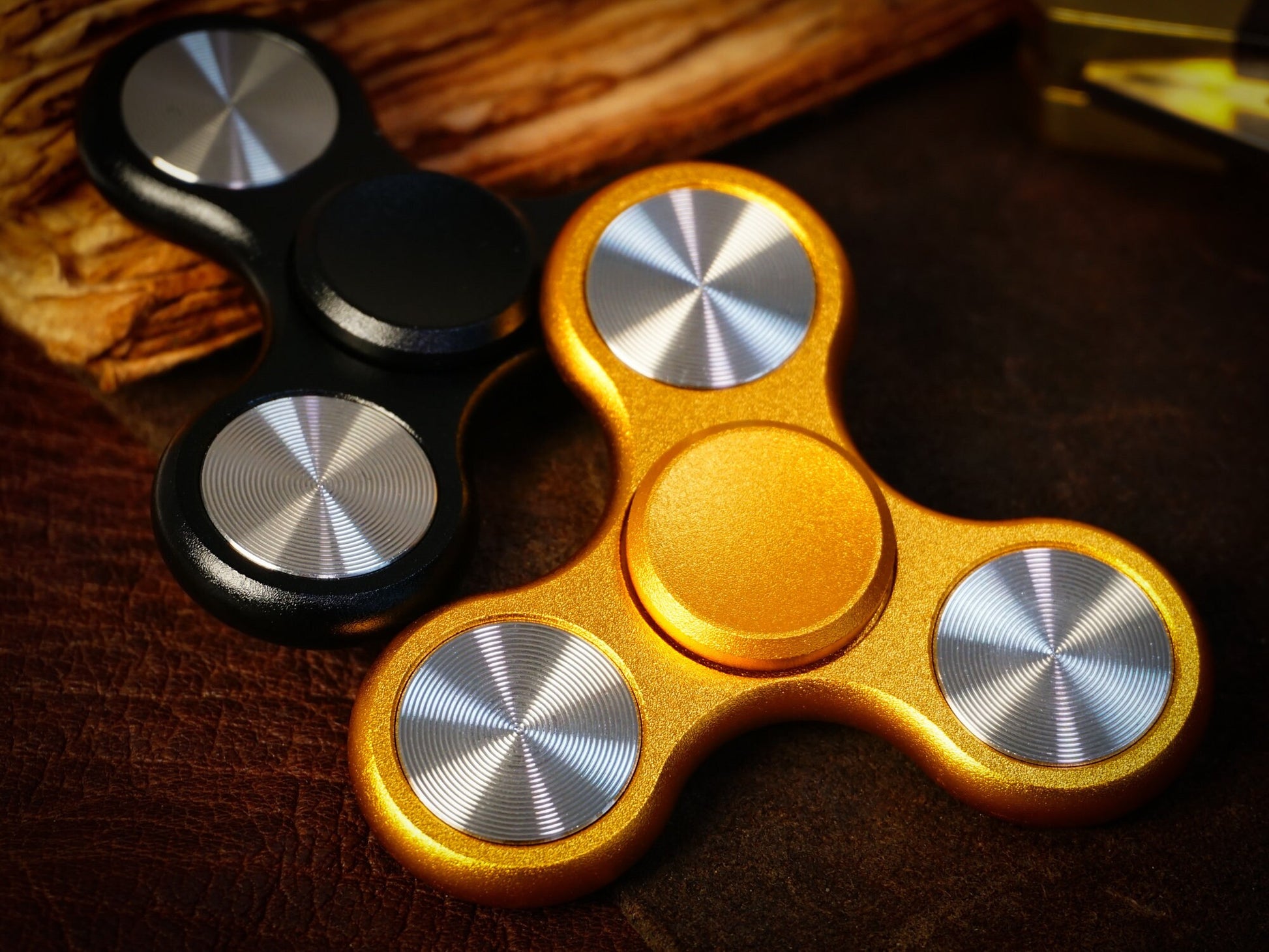 The Classic fidget spinner - tri shape metal spinner, in black, silver, blue, red, and orange