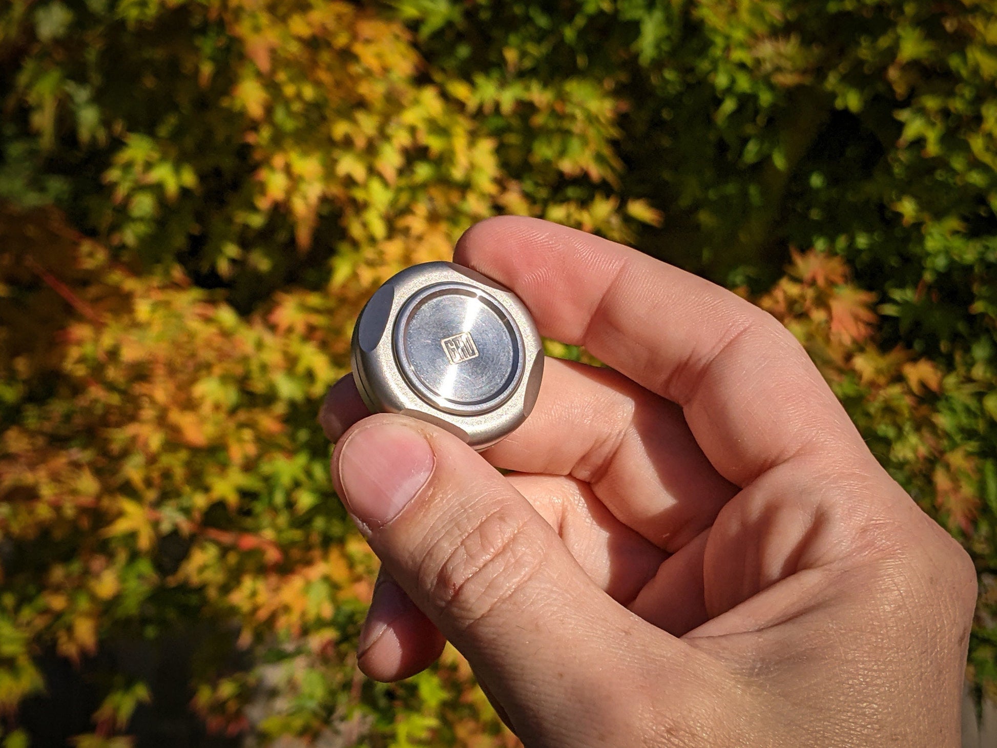 stainless worry stone, dual spinning fidget coin, edc coin, haptic coin