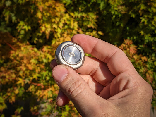 stainless worry stone, dual spinning fidget coin, edc coin, haptic coin